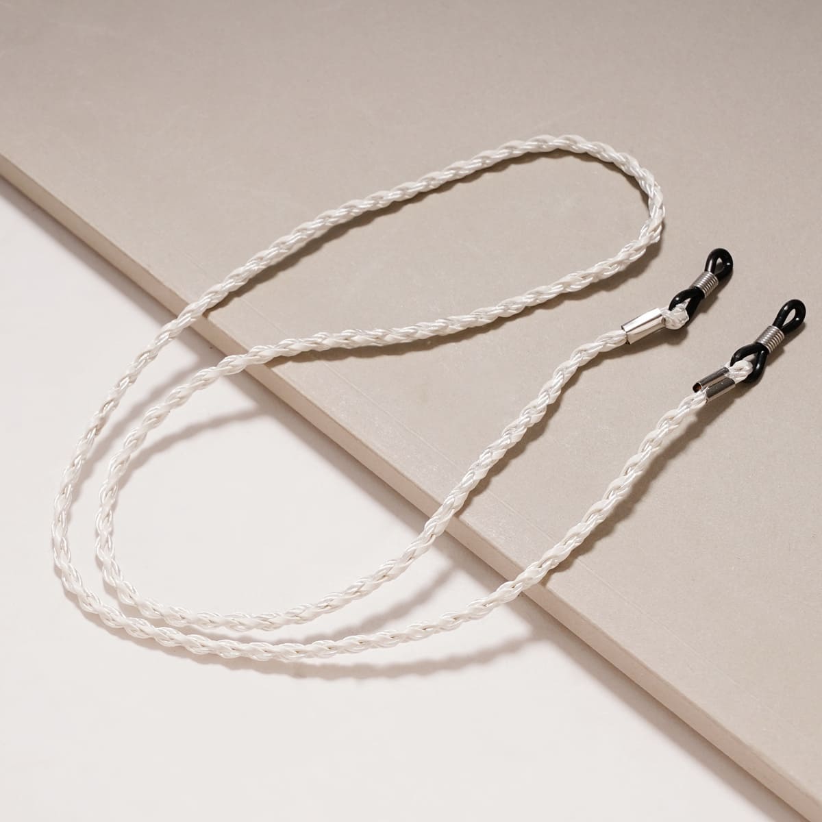 attache lunette femme blanc