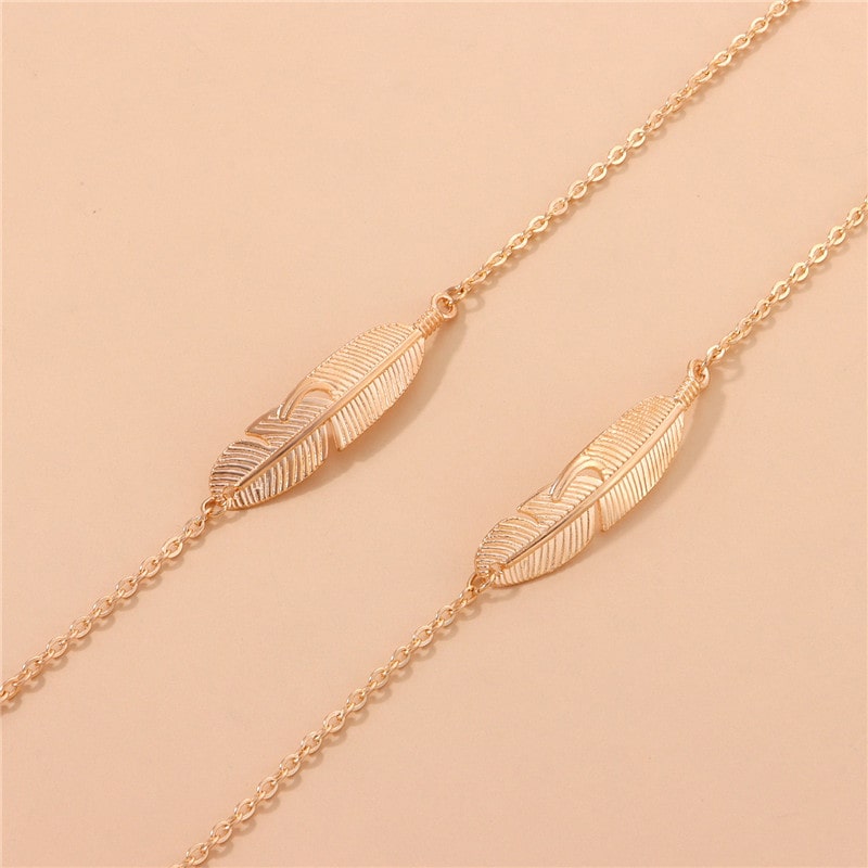chaine lunette collier plume or