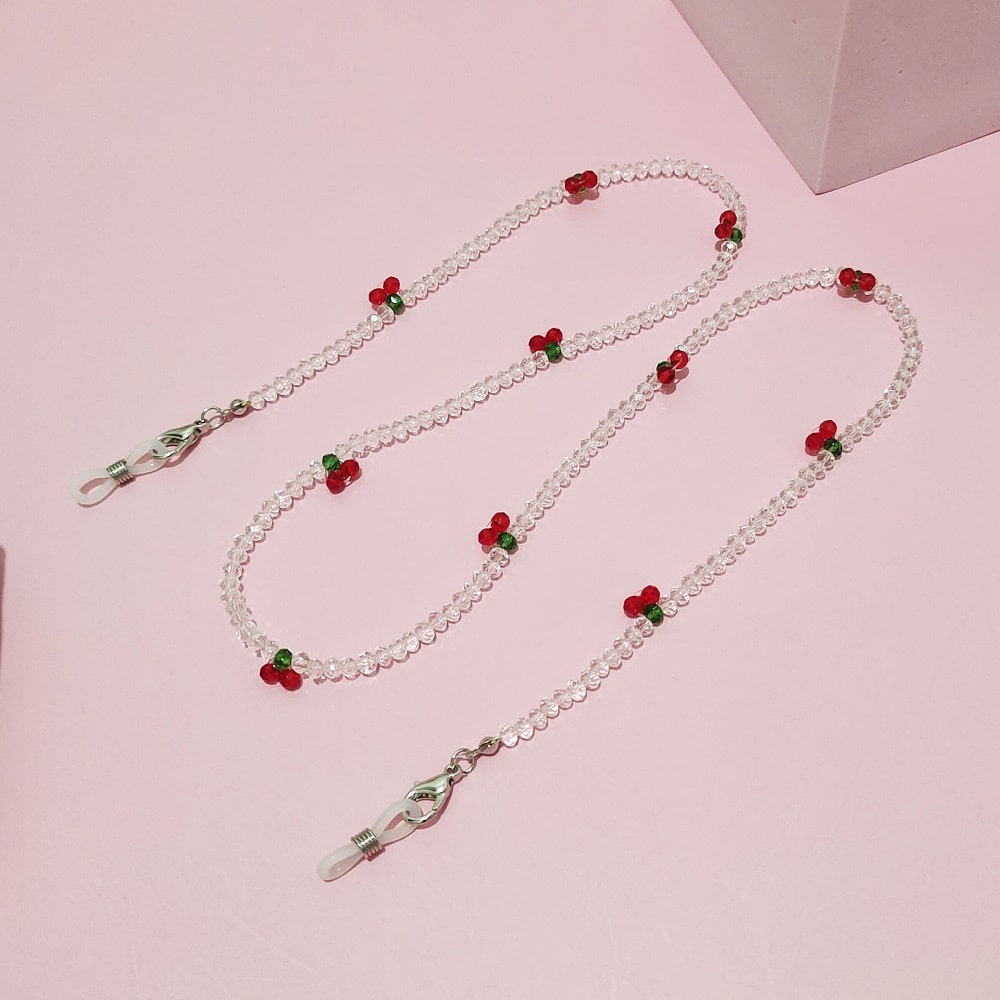 collier pour lunettes de vue cerise perles transparentes